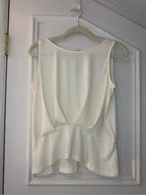 Roomy’s Ivory Open Back Draped Peplum Tank Top